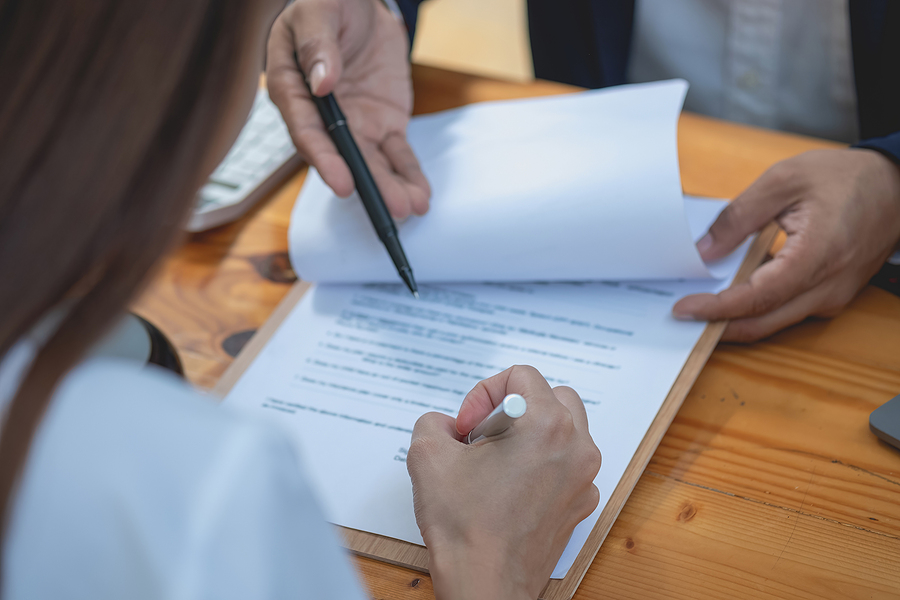 An image showcasing legal elements and a compass, symbolizing the guidance offered by Meritus Group in avoiding legal mistakes.
